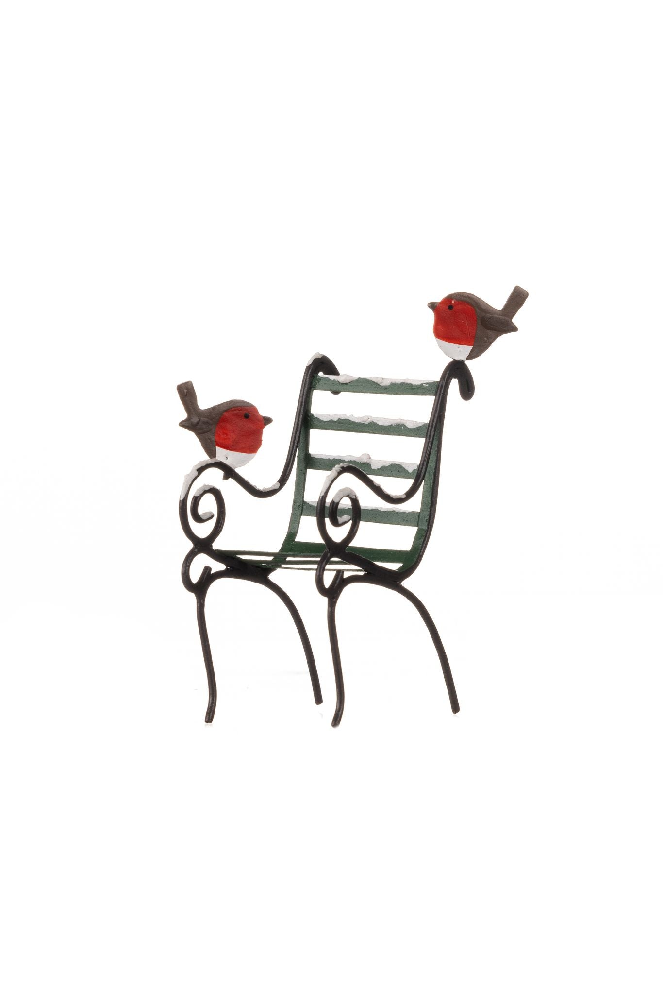 Robins on a snowy park chair