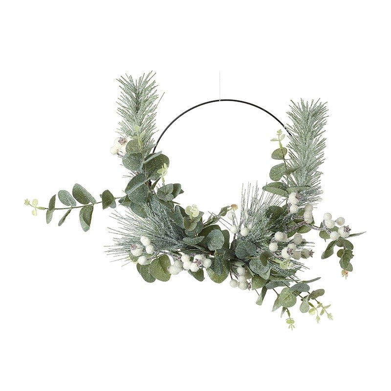 Green leaf and white berry on metal wreath