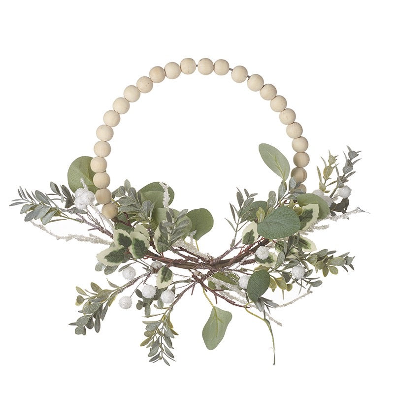 Wooden bobbin wreath with white berries and greenery