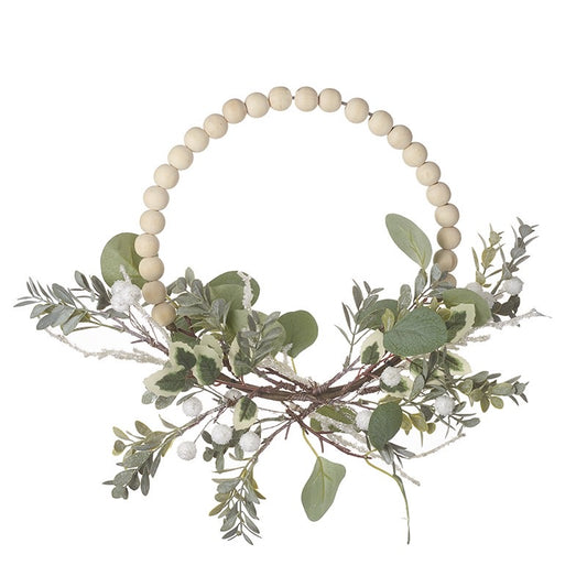 Wooden bobbin wreath with white berries and greenery