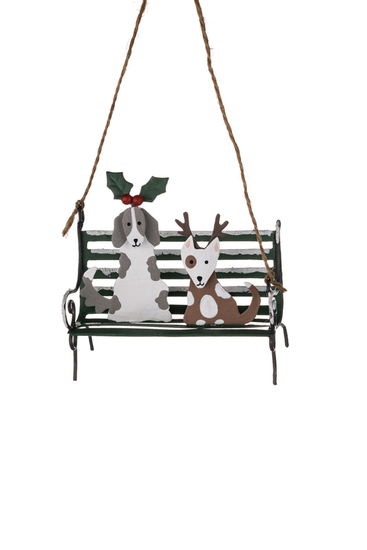 Dogs on a snowy park bench