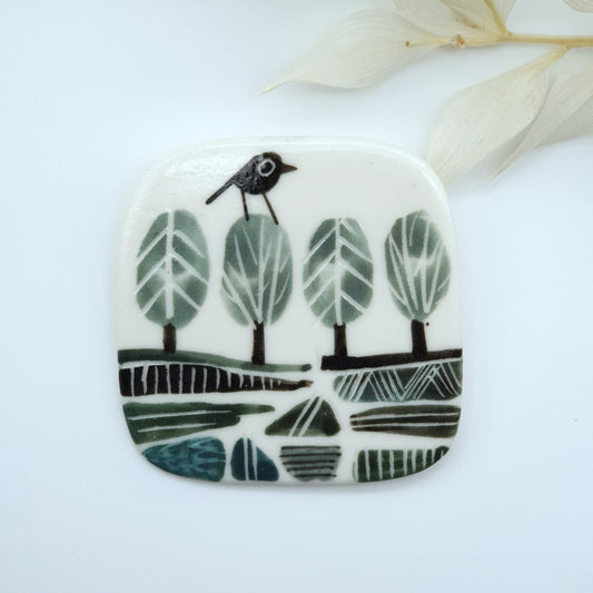 Ceramic Brooch-  Bird on a tree landscape